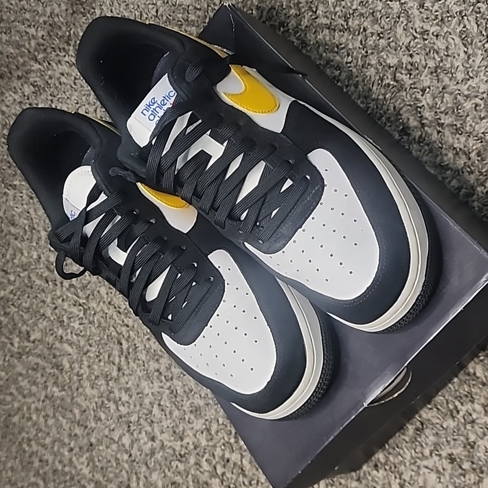 Low top Nike Air Force Ones. Only worn 3 maybe 4 times. Black & Yellow